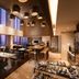 DoubleTree by Hilton Hotel Jakarta - Diponegoro dining room with city skyline views in Jakarta