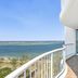 Crystal Bay On The Broadwater balcony with table and chairs overlooking the water in Clear Island Waters