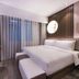 Crystal Orange Beijing South Station Muxiyuan Hotel guest room with king bed and desk in Beijing