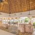 Royal Decameron Salinitas in Acajutla lobby with thatched ceiling, fans and open-air seating