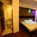 Sudha's Garden Home Kathmandu guest room with double bed, bathroom and small table