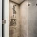 Yays Amsterdam North By Numa Amsterdam bathroom shower with glass enclosure and handheld showerhead
