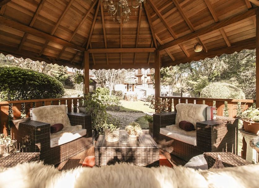 Pousada das Hortensias in Campos do Jordão, wooden gazebo seating with garden view