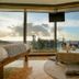 Viewtower Resort in Jeju City guest room with floor-to-ceiling ocean view and low table seating