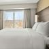 Residence Inn by Marriott Davenport guest room with king bed, TV and window view