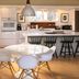 Woodstock Way Hotel in Woodstock kitchen with white island, round dining table and modern chairs