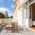 Domaine de Bassilour in Bidart, terrace with table and chairs beside an open room and garden view
