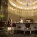 JW Marriott Hotel Bengaluru bar lounge with chandelier and guests seated at a stylish circular bar