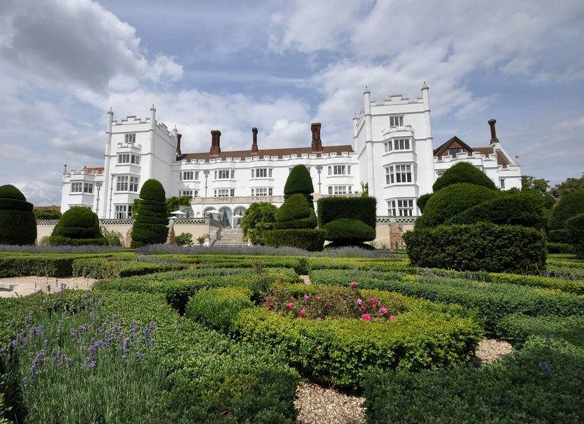 Danesfield House Hotel And Spa in Marlow with manicured gardens and a grand white facade