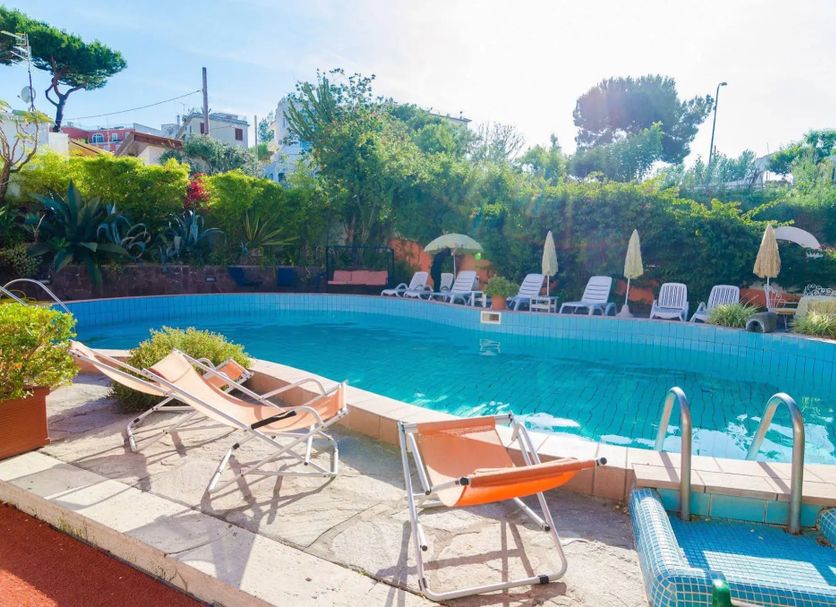 Hotel Aragonese, Ischia: outdoor pool with lounge chairs, umbrellas and garden views