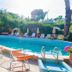 Hotel Aragonese, Ischia: outdoor pool with lounge chairs, umbrellas and garden views
