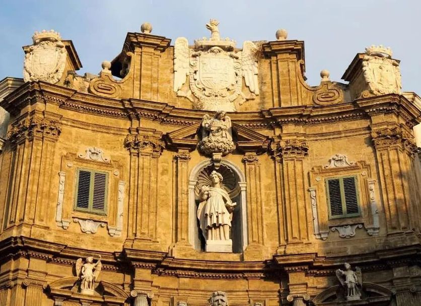 Balate Maqueda B&B in Palermo, ornate historic hotel facade with statue niche and carved stone details