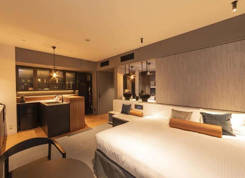 Hotel Keihan Namba Grande, Osaka: modern hotel room with bed, desk, and kitchenette area