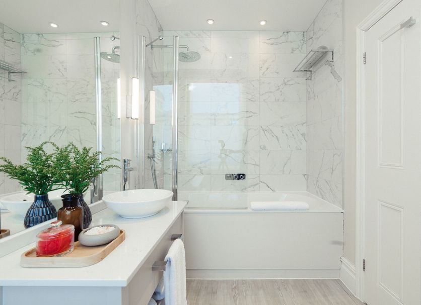 The Charm Brighton Boutique Hotel and Spa bathroom with bathtub, glass shower, and vanity in Brighton