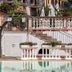 Pool terrace at Albergo Ristorante San Matteo in San Bartolomeo al Mare with stairs, railings, and potted plants