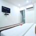 OYO 3815 Hotel Jaisingh Palace room in Indore with bed, wall TV and air conditioner