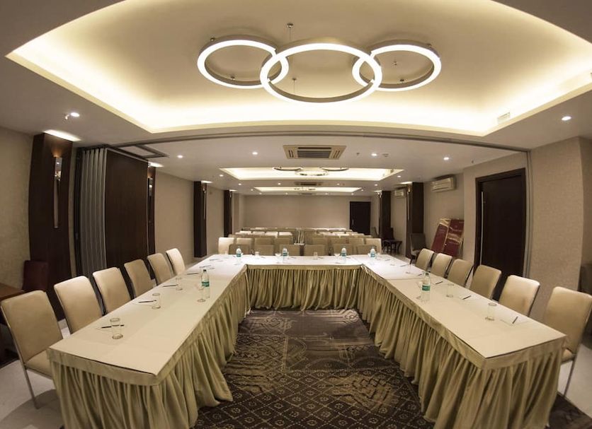 Connaught Royale Delhi meeting room in New Delhi with U-shaped conference table and modern ceiling lights