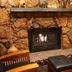 Lodge At Sedona in Sedona, stone fireplace seating area with leather chairs and ottoman