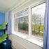 Yha Truleigh Hill dorm room with bunk beds and countryside view through large windows