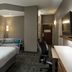 Courtyard by Marriott Kansas City East/Blue Springs guest room with king bed, sofa bed and desk