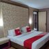 Benakutai Hotel and Apartemen room in Balikpapan with double bed and red accent runner
