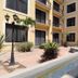 Hotel Casa Real Tehuacan courtyard with fountain, palm plants and balconies in Tehuacán
