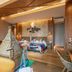 Expo Garden Resort Hotel in Jinan guest room with two beds and woven lounge chairs