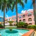 Mizner Place at Weston Town Center courtyard with palm trees and fountain in Weston