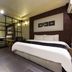Suwon Ingyedong The Blixx room in Suwon with bed, desk, and glass partition bathroom