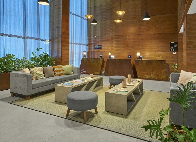 City Express Plus by Marriott Tijuana lobby lounge with sofas, low tables and tall windows