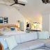 Winslow's Bungalows in Key West: bright loft-style suite with king bed, sofa, and ceiling fan