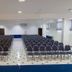 Hotel Vieira's in Balneário Camboriú conference room with rows of chairs and tiled floor