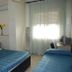 Piccolo Lamezia Terme guest room with two beds, window with sheer curtains, and desk