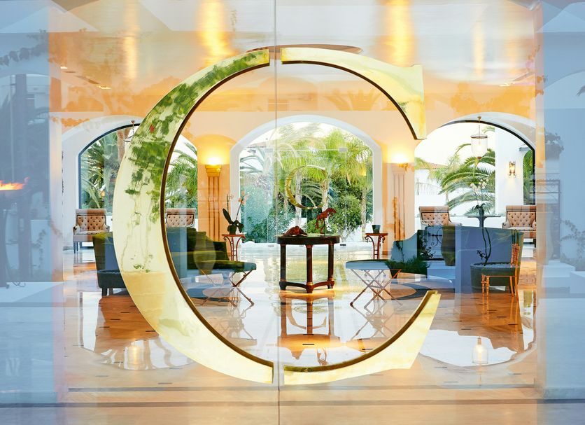 Caramel, A Grecotel Resort to Live in Adelianos Kampos, elegant lounge with illuminated circular decor