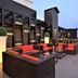 Yogi Executive, Navi Mumbai rooftop lounge with red seating and sea view