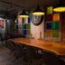 Luna Boutique Hotel Antalya lounge with long wooden table, pendant lights and colorful window panels