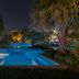 Acoya Curacao Resort, Villas & Spa in Willemstad: illuminated pool and tropical landscaping at night