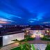 Meliá Llana Beach Resort & Spa in Santa Maria, illuminated resort courtyard under a dramatic blue sky