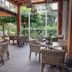 Van der Valk hotel Harderwijk patio dining area with wicker chairs and garden views