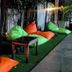 Crystal Suites Suvarnabhumi Airport, Bangkok outdoor lounge with colorful bean bags and tables