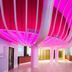 Atrium Hotel Heathrow in Hounslow lobby with pink-lit curved ceiling and check-in desk