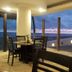 Mar Paraiso Queen in Acapulco patio dining area with ocean view at sunset