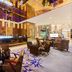 The Longemont Shenyang lobby lounge with bar, seating area and ornate ceiling lighting
