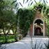 Hacienda La Magdalena in Zapopan with ivy-covered brick archway and garden walkway