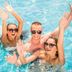 Guests smiling and waving in the pool at Western Motel Inn and Suites Hazlehurst in Hazlehurst