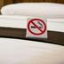 Western Motel Inn and Suites Hazlehurst bed with no smoking sign in guest room