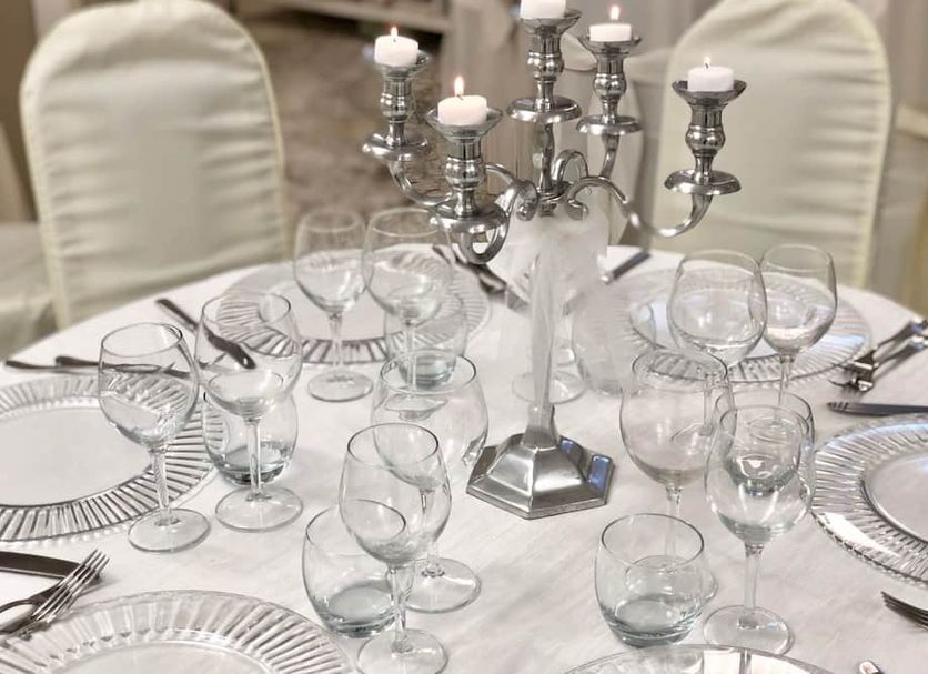 Hotel Caserta Antica in Caserta: elegant dining table set with glassware, plates, and silver candelabra