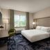 Fairfield by Marriott Inn & Suites Chilliwack guest room with king bed, desk, chair and window