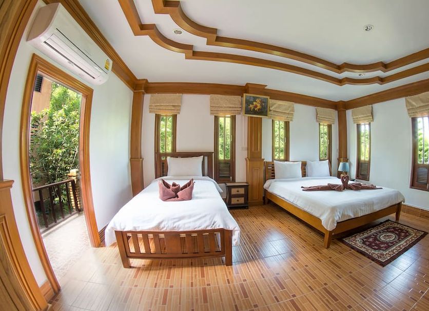 Tanote Villa Sha Extra Plus in Ko Tao guest room with two beds and balcony view