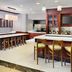 Hilton Garden Inn Virginia Beach Town Center bar and lounge with stools and TV